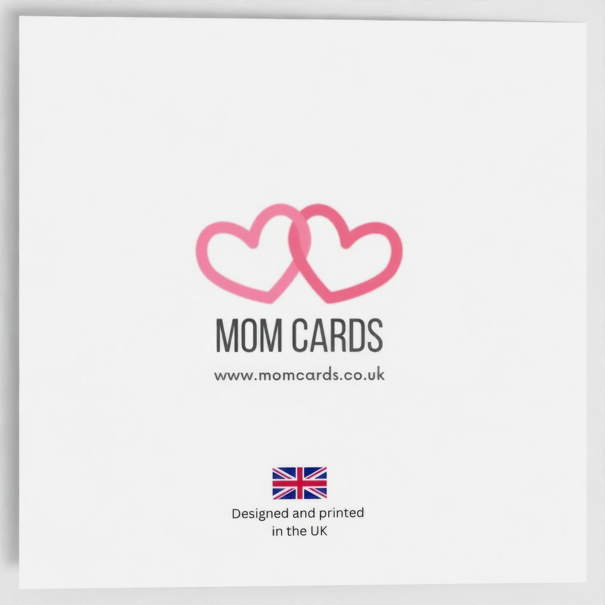 The back of the Christmas card. Includes Mom Cards logo (two pink entwined hearts), website address and the text "Designed and printed in the UK".