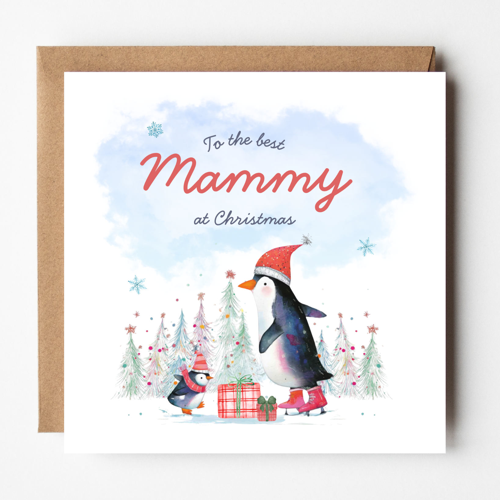 A mockup of the Skating Penguins Mammy card, shown with brown Kraft envelope.