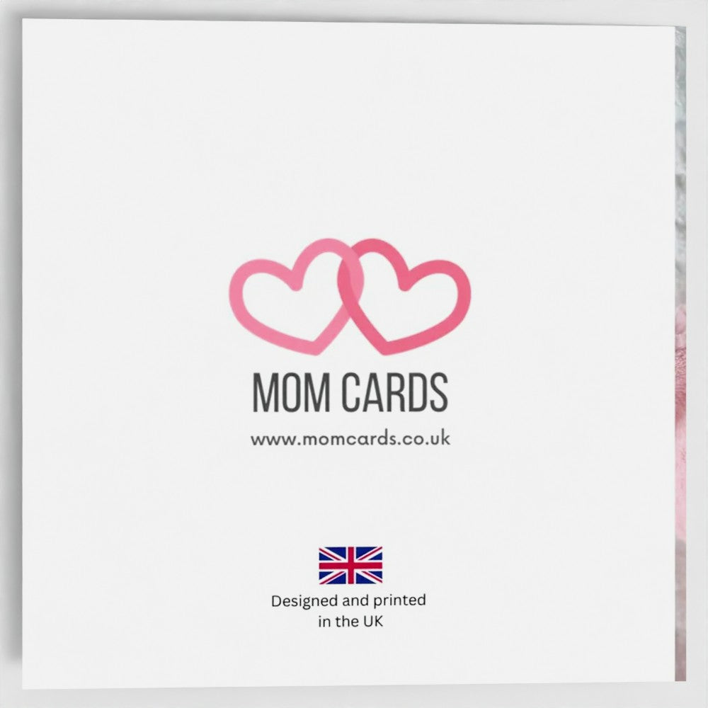 Outside back of the card. Includes Mom Cards logo (two entwined pink hearts), web address and "Designed and printed in the UK" text with Union Jack image.