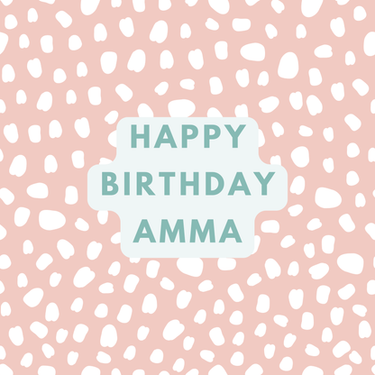 The card design. Text reads: "Happy Birthday Amma" in green text. Pink background with white paint dabs.