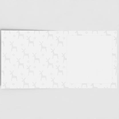 The inside of the card. Pastel grey reindeer pattern, with a blank white square to write your own message in.