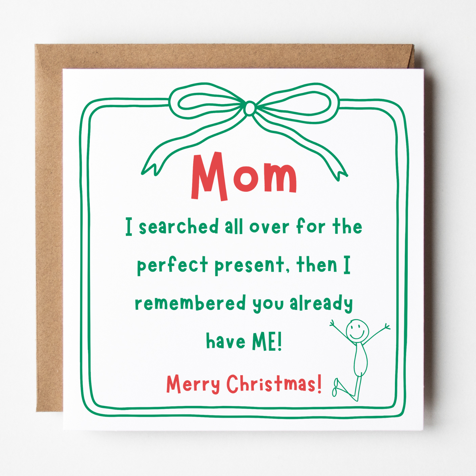 A mockup of the Perfect Present Christmas card, shown with brown Kraft envelope.