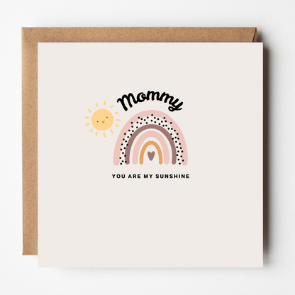 Card design: rainbow and smiling sunshine in muted pastels. Text reads: "Mommy, you are my sunshine."
