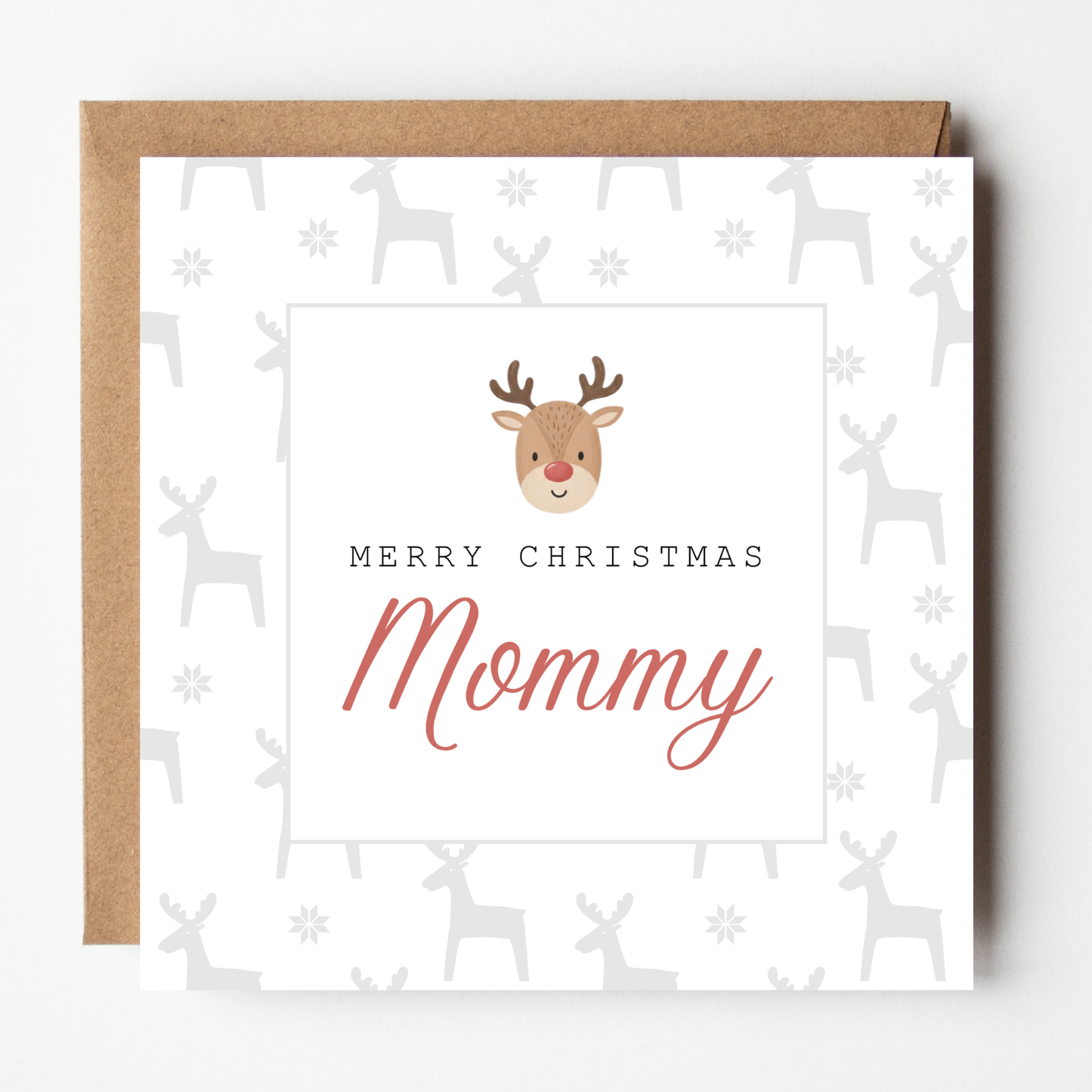 A mockup of the Baby Rudolph Christmas card, shown with brown Kraft envelope.
