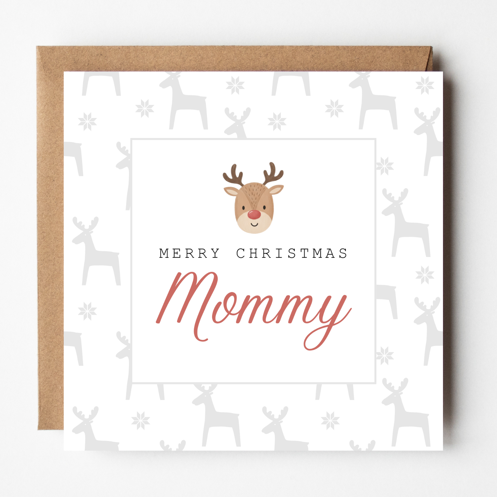 A mockup of the Baby Rudolph Christmas card, shown with brown Kraft envelope.