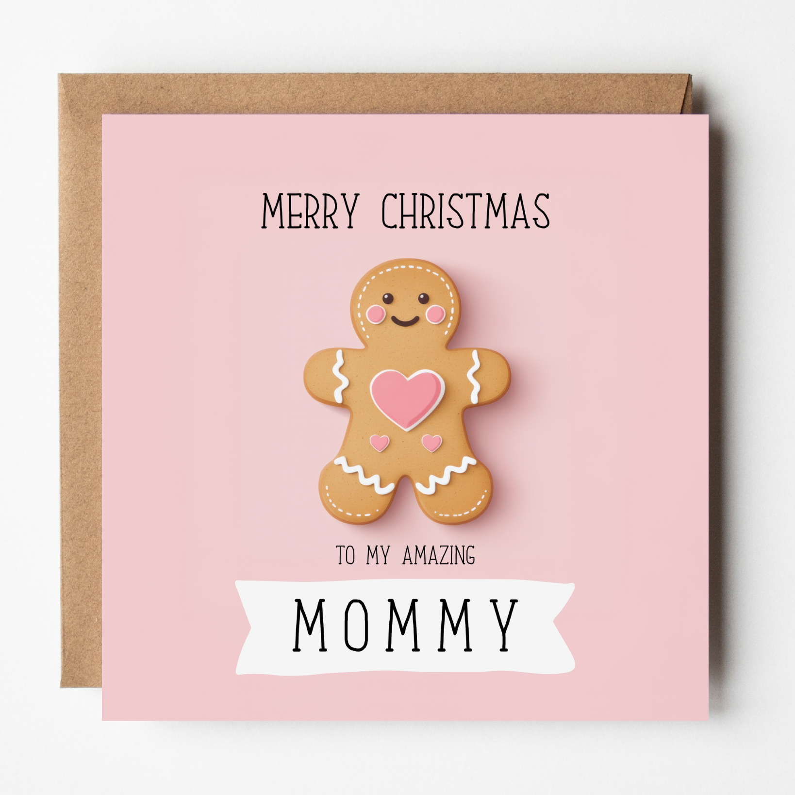 A mockup of the Gingerbread Mommy Christmas card, shown with brown Kraft envelope.