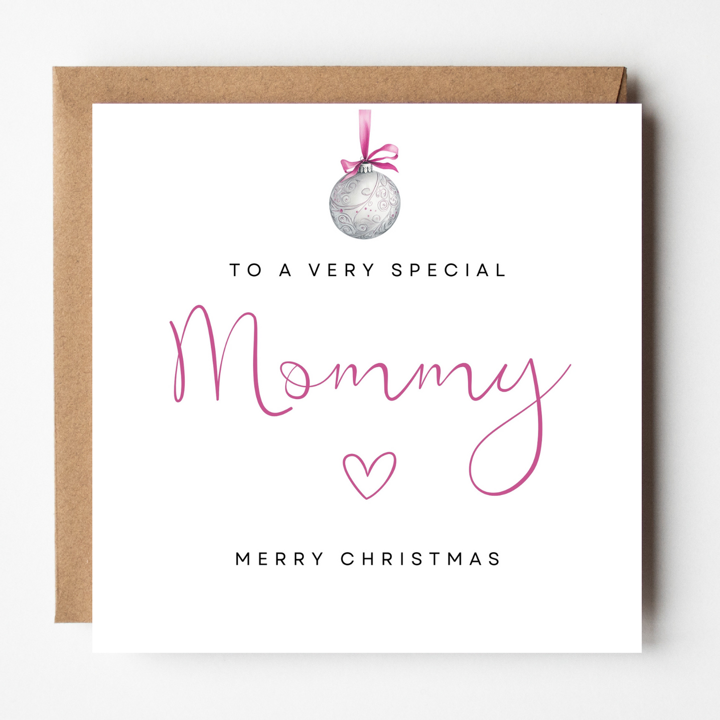 A mockup of the Mommy Pink Bauble Christmas card, shown with brown Kraft envelope.