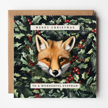 The design: lifelike painting of a red fox peering out through winter foliage. Text reads: Merry Christmas to a wonderful Stepmam.
