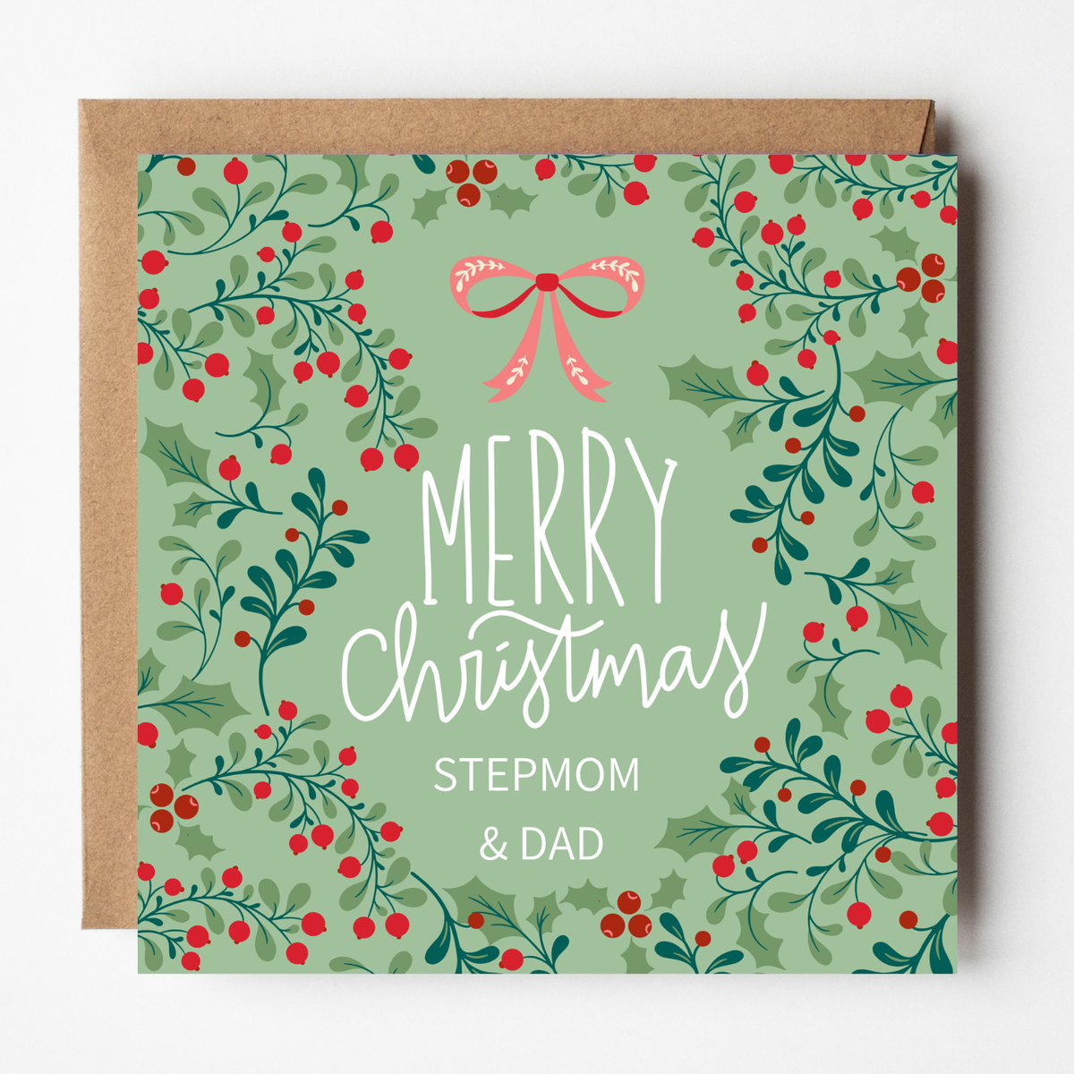 A mockup of the Holly Berries Christmas card for Stepmom & Dad, shown with brown Kraft envelope.